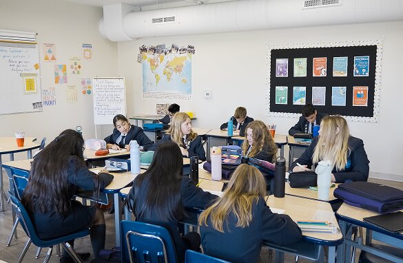 Students working at their desks in a bright Kempenfelt Bay School classroom